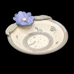 Handcrafted Pottery Bowl With Decorative Flower Accent